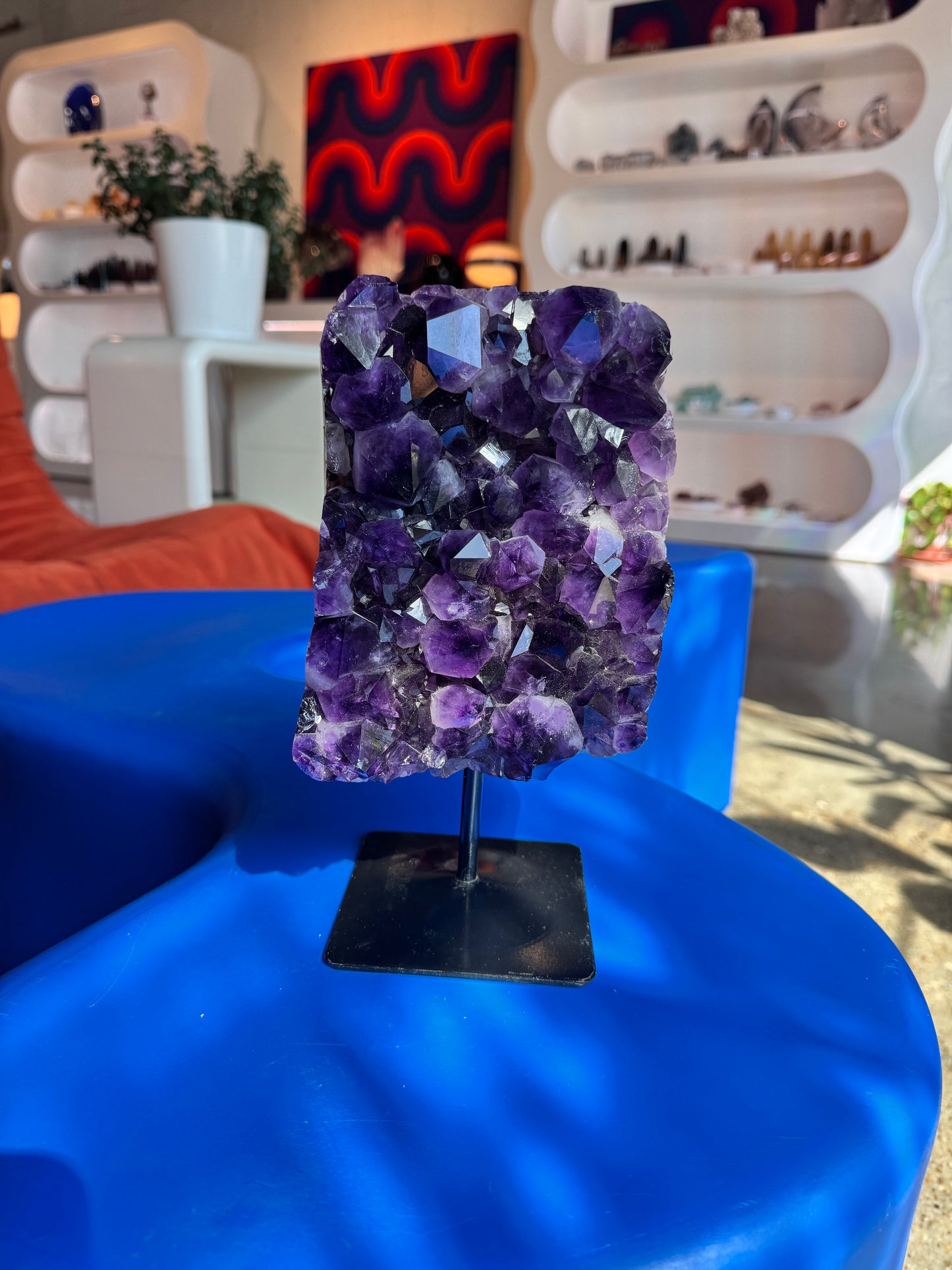 Large amethyst cluster on stand
