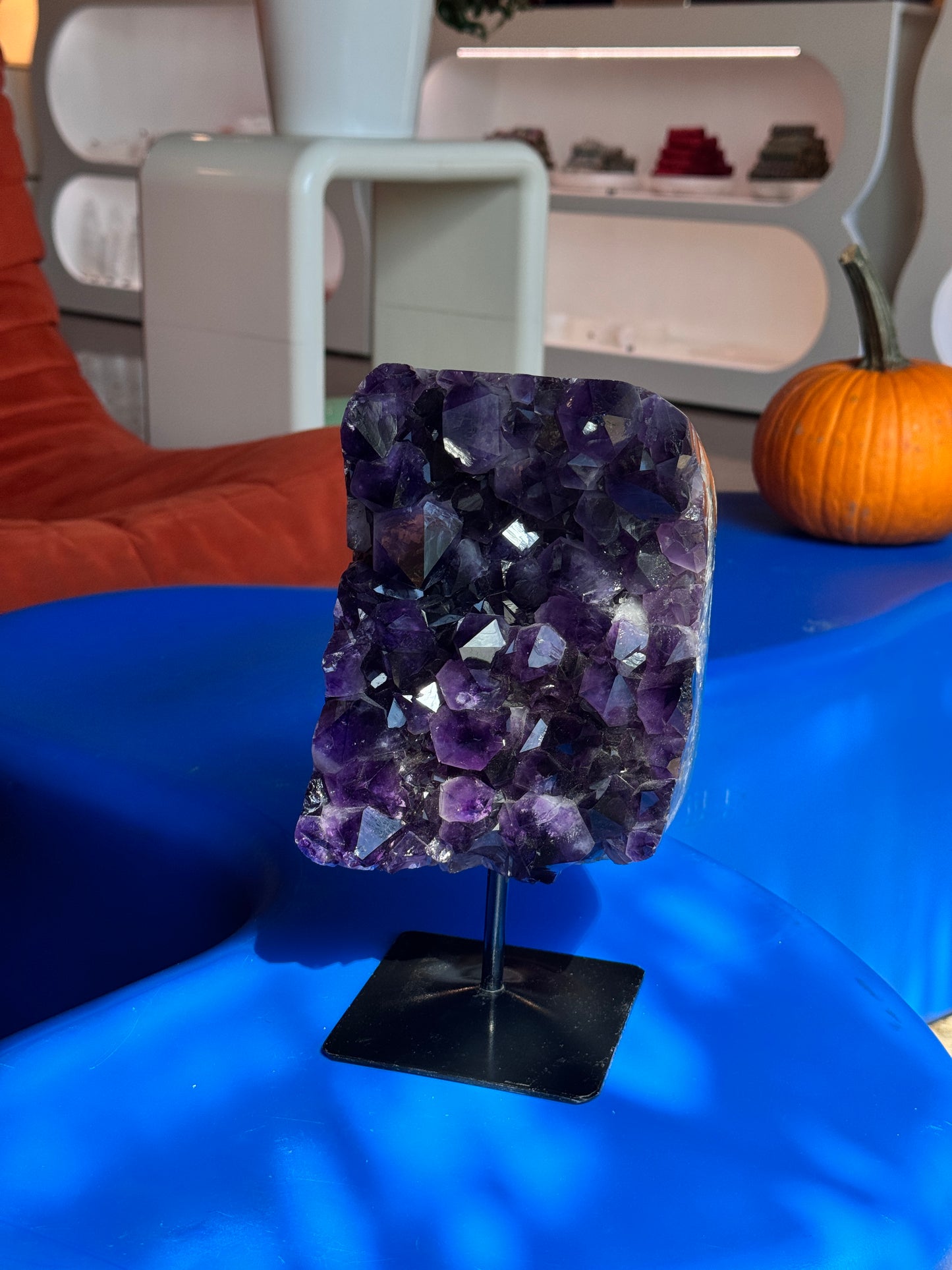 Large amethyst cluster on stand